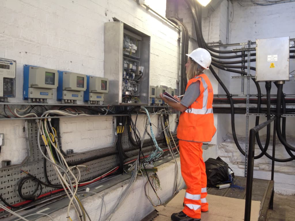 Engineer on site checking control panel